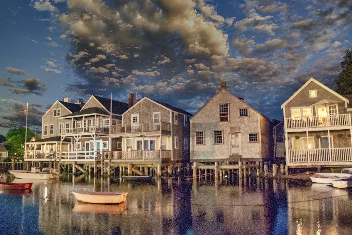 A town above the waters with boat.