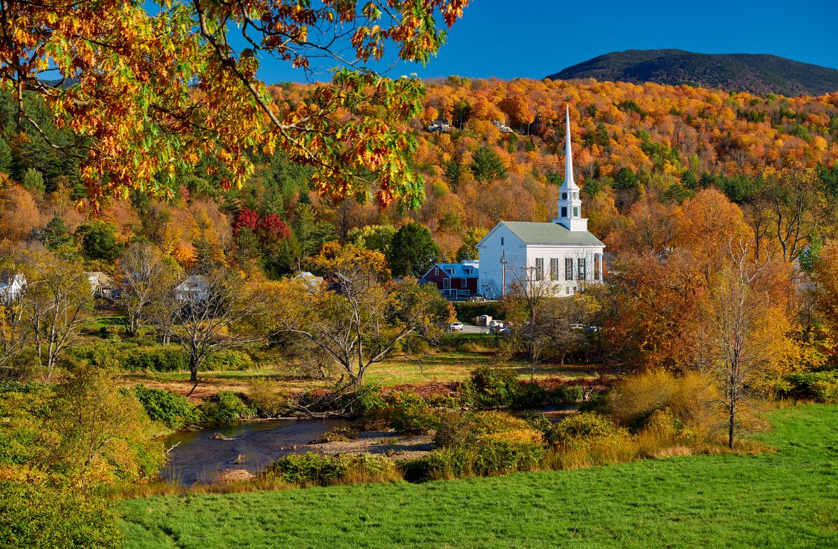 A church with a pond, fall in Stowe Vermont.