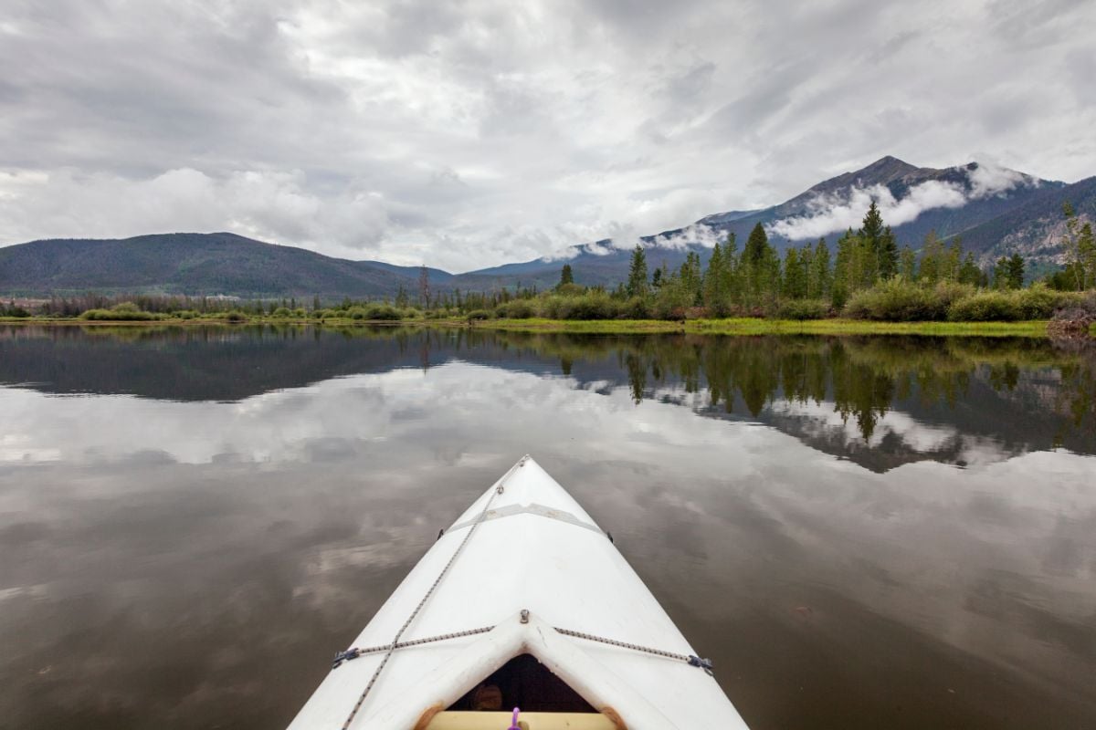 A tourist Kayaking at a lake at Dillon, Colorado.