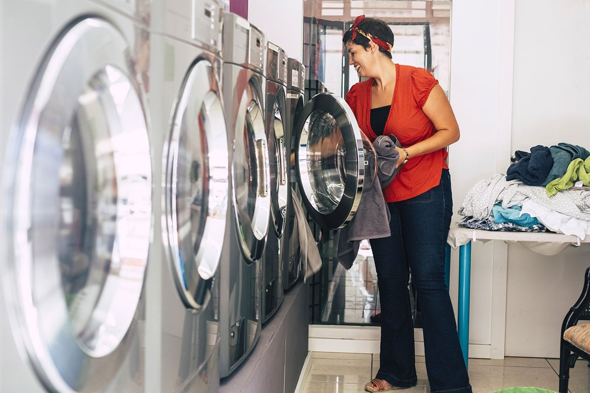 A lady doing a their own laundry.