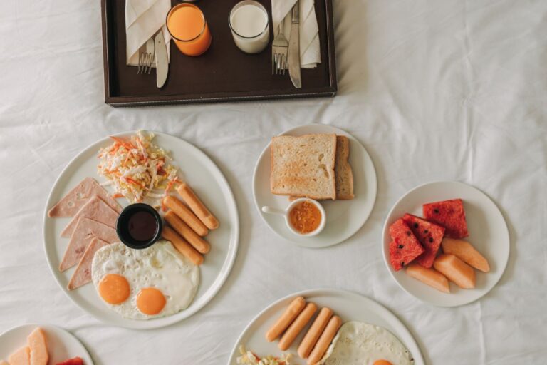 Hotel breakfast, with bread and fresh fruits.