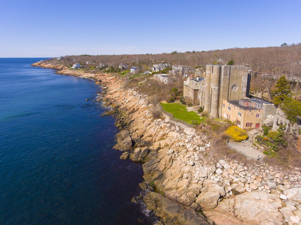 Coastal beach and a historical castle.