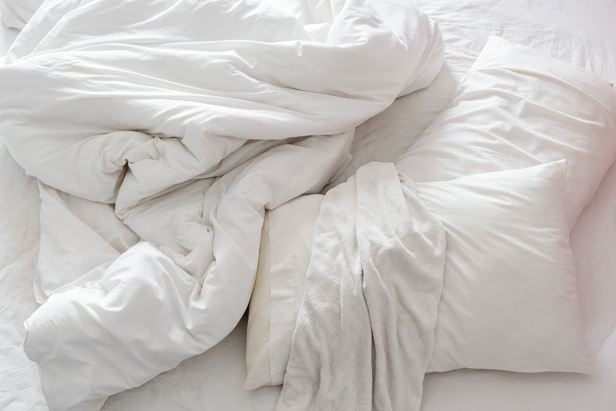 Comforter and pillows on the bed.