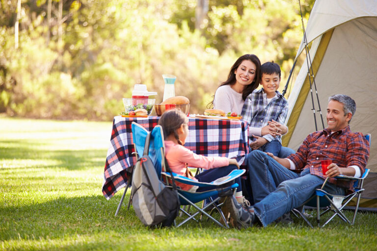 A family having a breakfast in a camping.