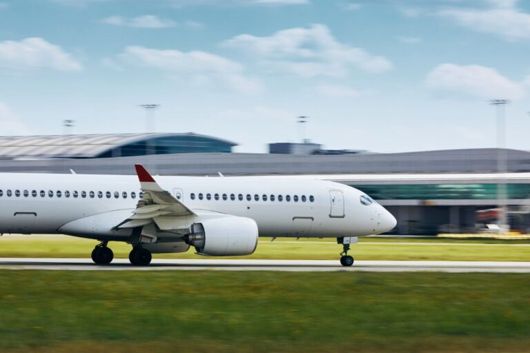 A commercial airplane taking landing on an airport.