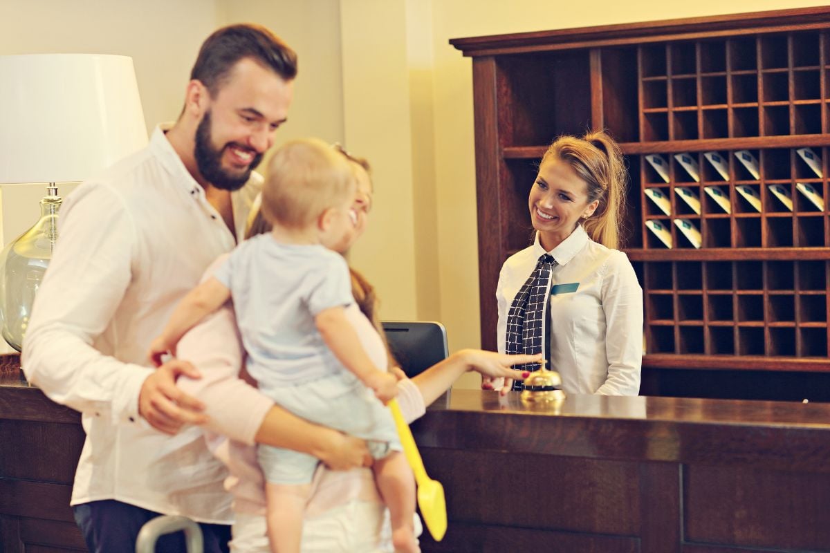 A family making a check in the hotel.