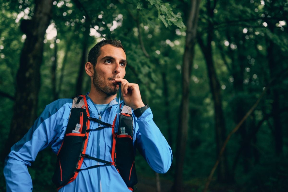 A man drinking from his hydration packs