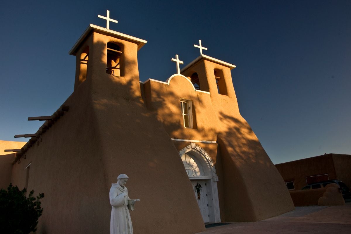 A Church with a statue at Taos, New Mexico.