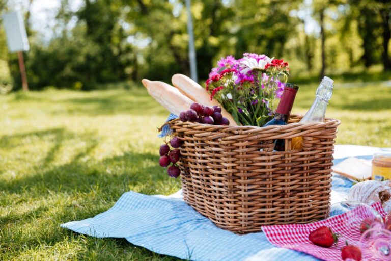 Picnic baskets with fruits and liquor.