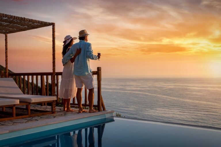 Couple enjoying on a resort on sunset.