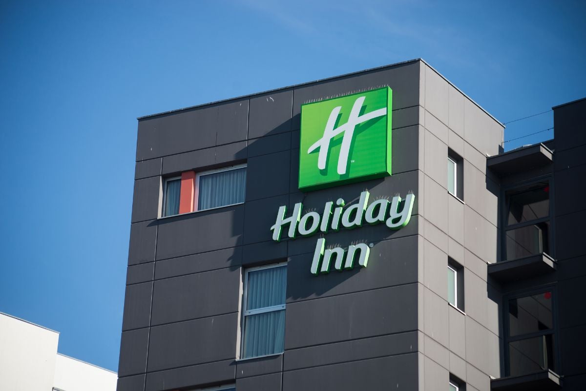 Signage of Holiday Inn and building.