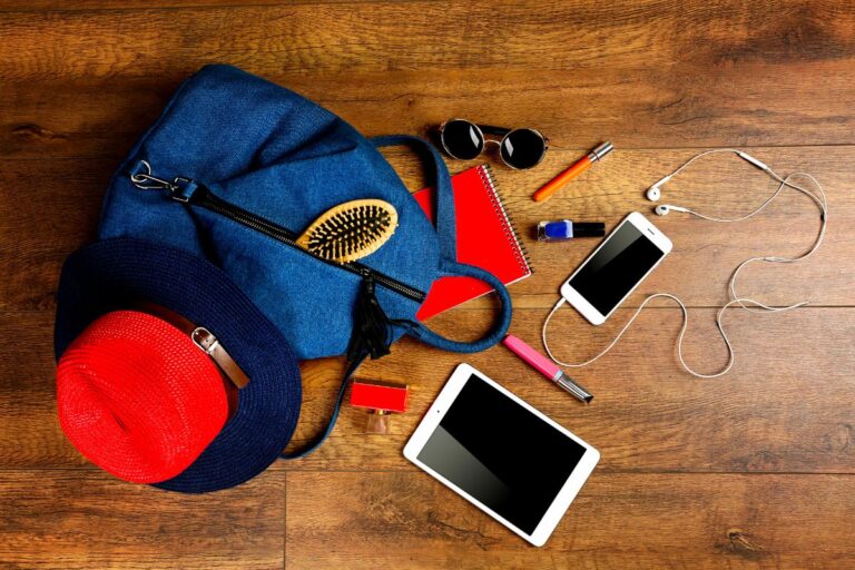 Different types of travel accessories on a bag.