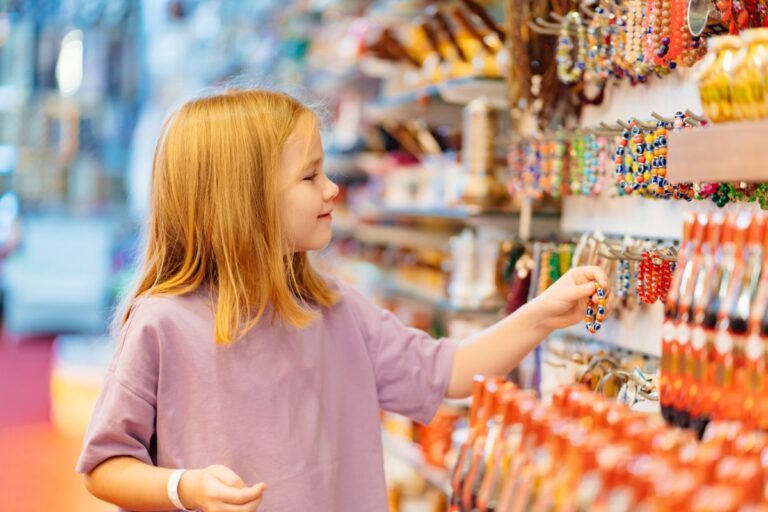 A girl selecting accessories on a store.