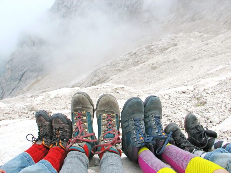 A family taking photo on a mountain top.