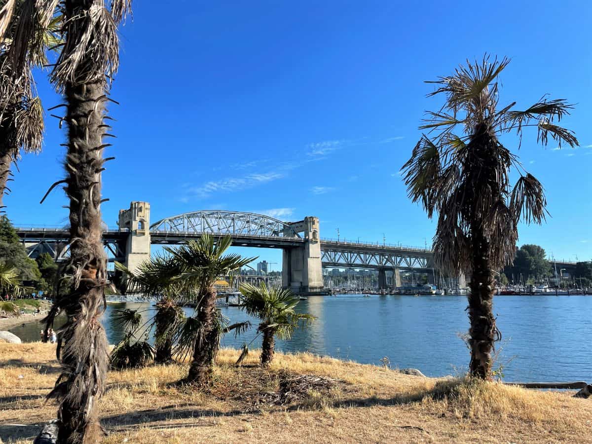 view of the burrard street bridge from sunset beach in vancouver