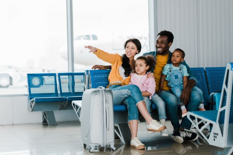 A family on a vacation with their luggage bag.