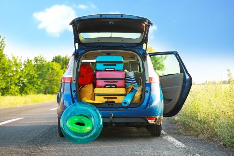 Open trunk with beach day luggage