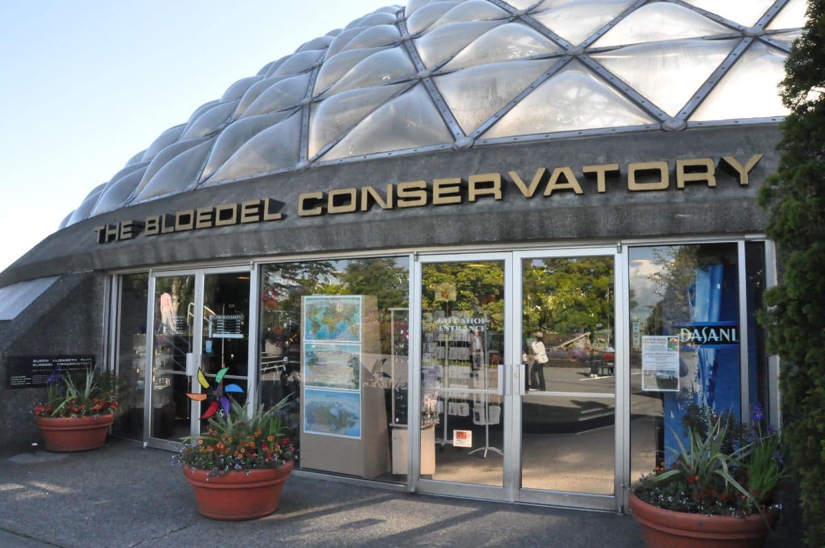 front doors of the bloedel conservatory building at queen elizabeth park in vancouver