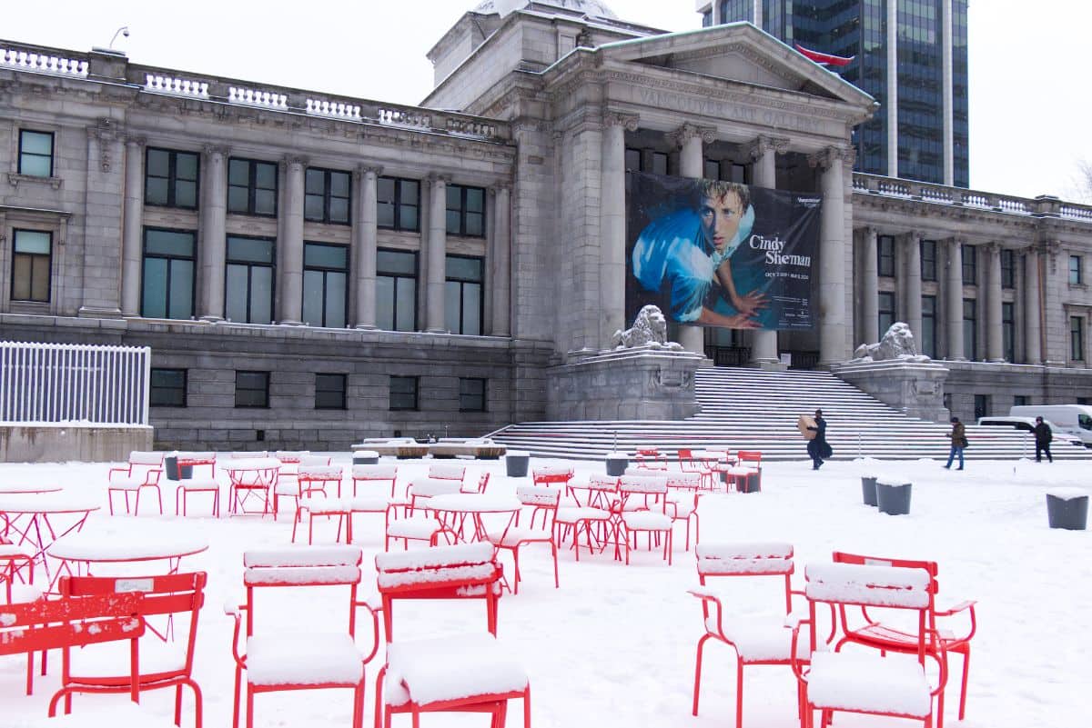 snow covered ground in front of the vancouver art gallery at winter time