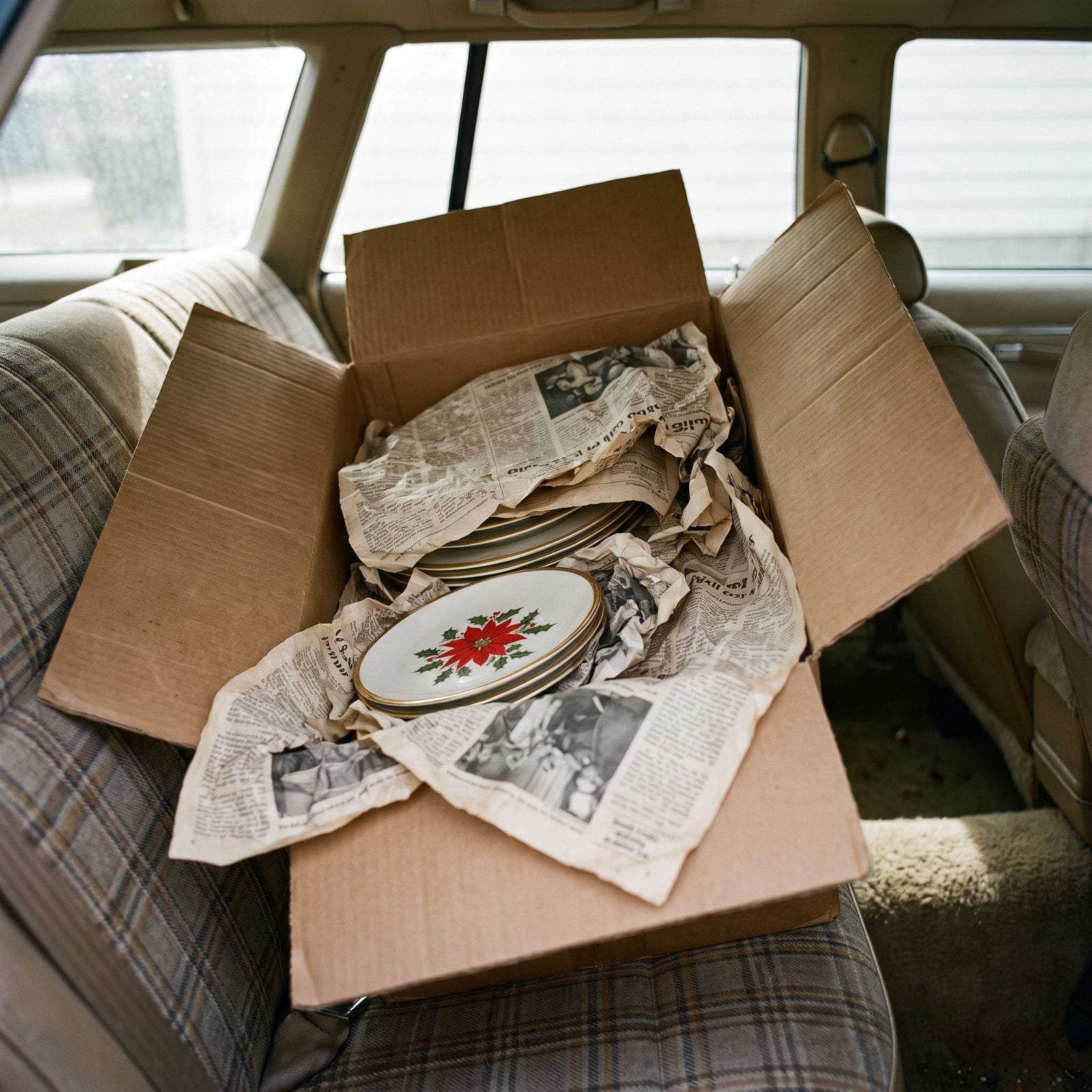 The Christmas China Packed Between Layers of Newspaper
