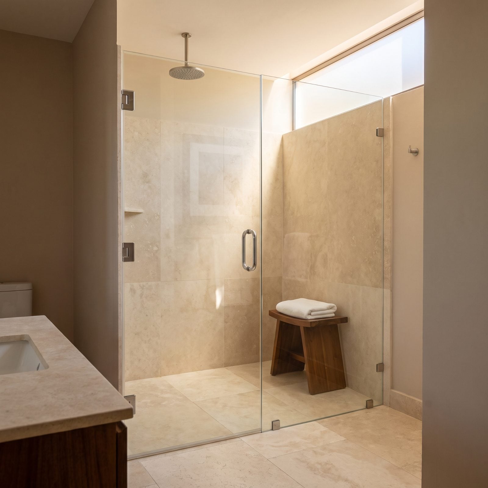 A Frameless Glass Shower Keeps the Full Room Visible