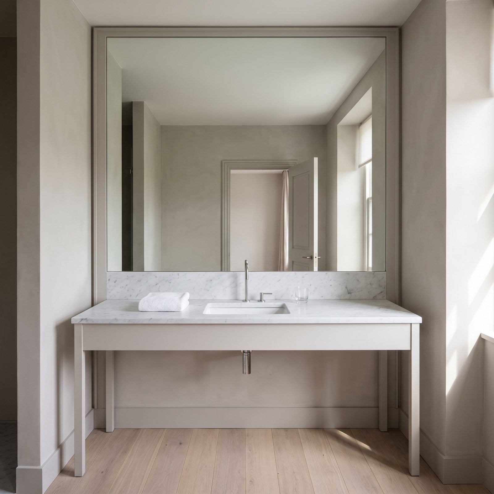 A Full-Wall Mirror Visually Doubles the Room