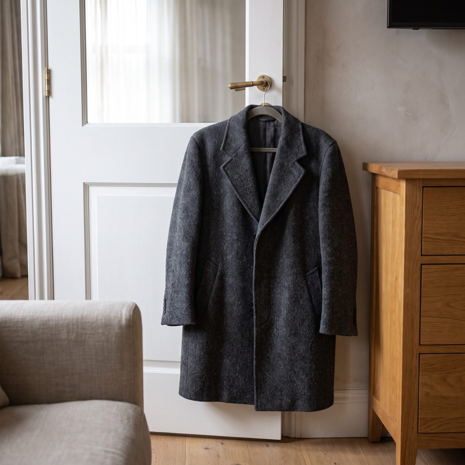 Hang a Heavy Coat Against a Connecting Door to Muffle Sound