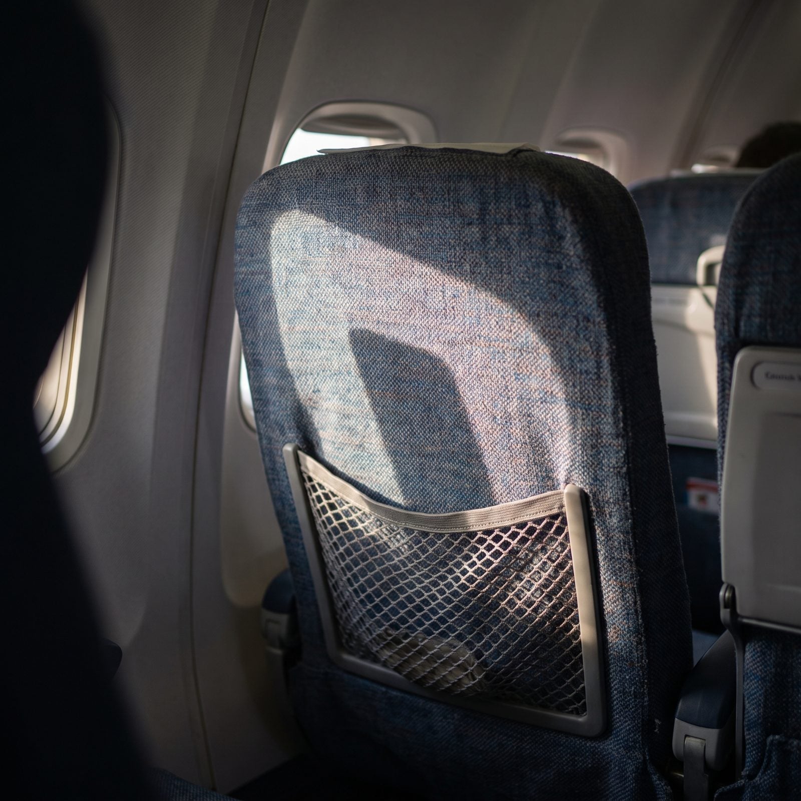Keeping Loose Belongings Out of Airplane Seat Pockets