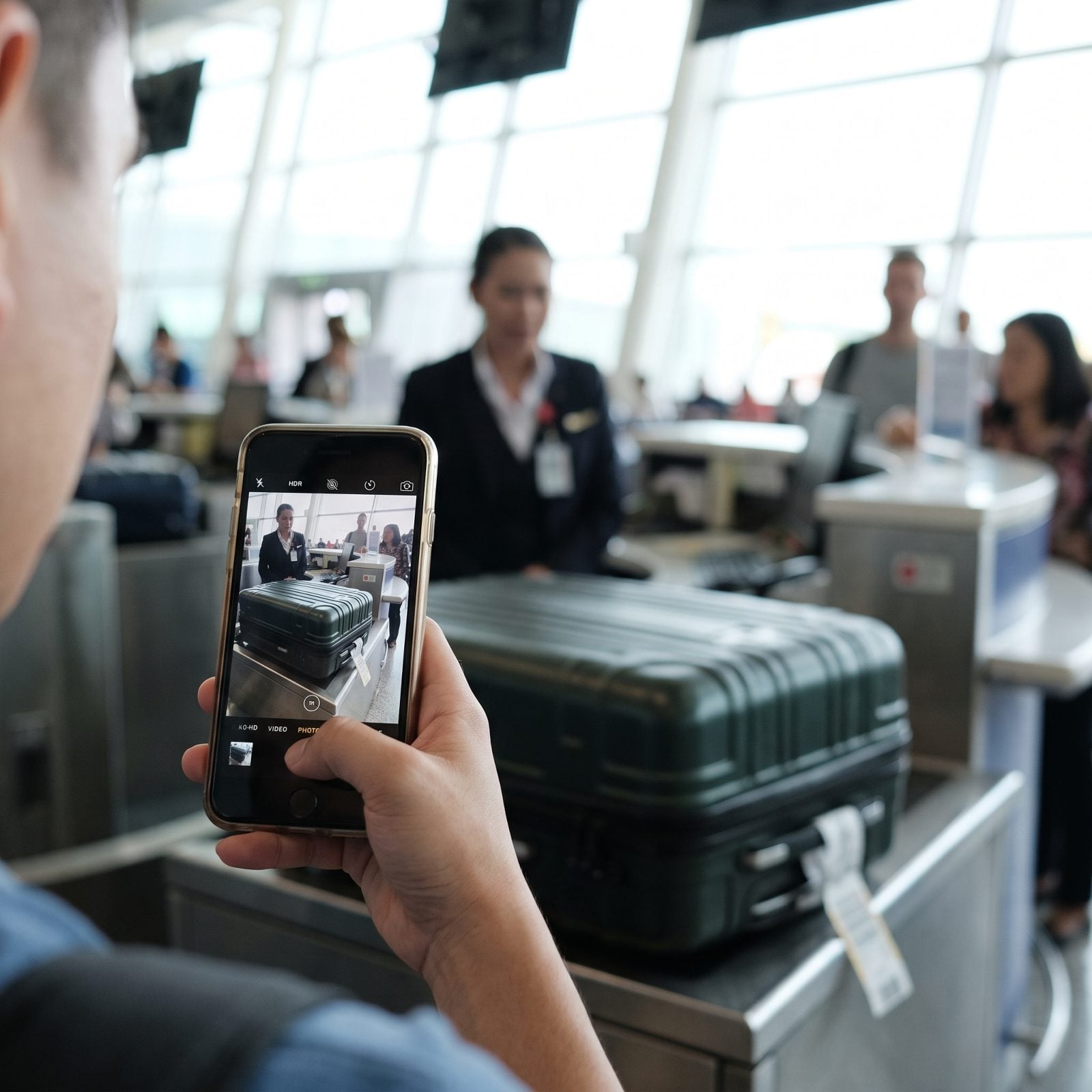 Photographing Checked Luggage Before Handoff