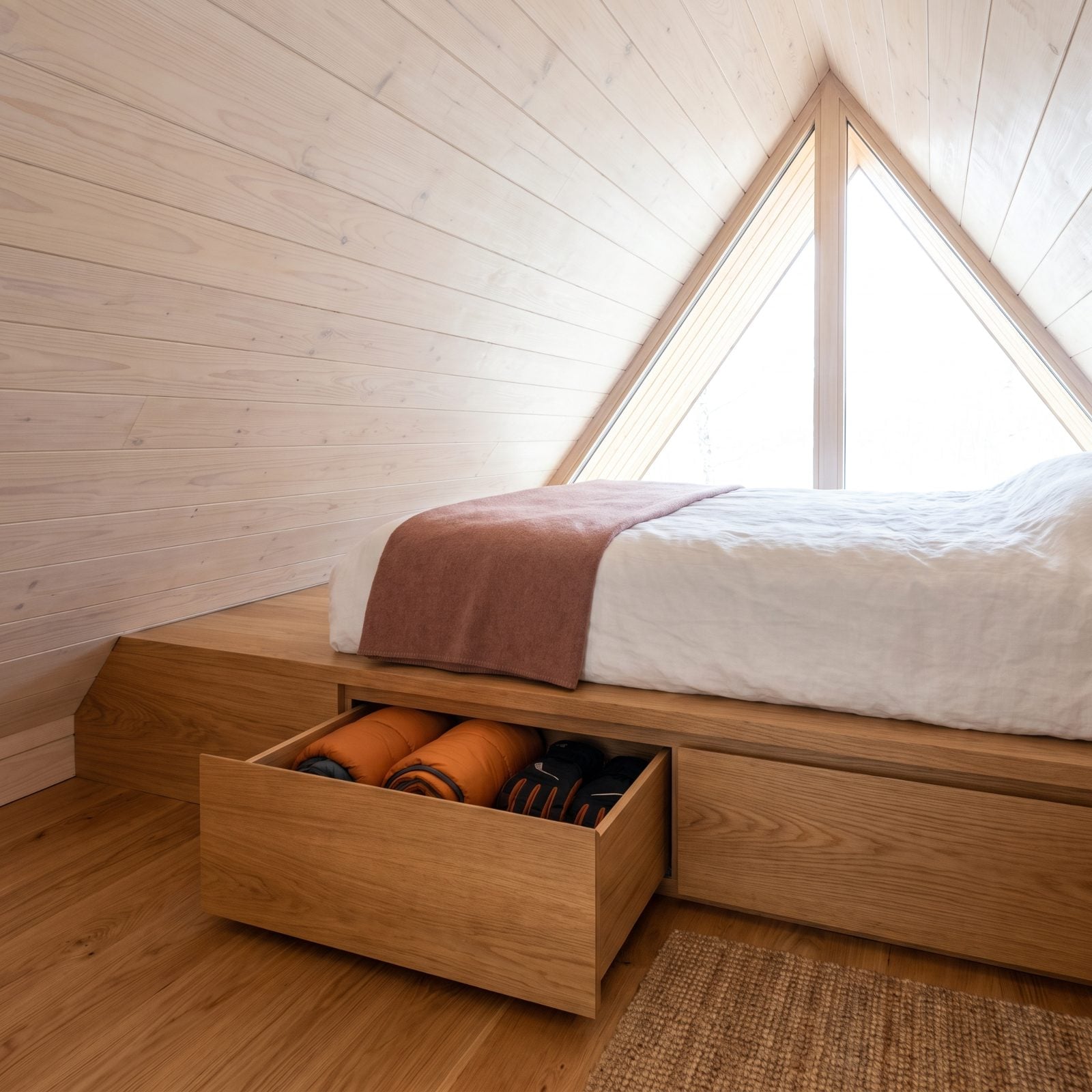 A Platform Bed Conceals Seasonal Gear