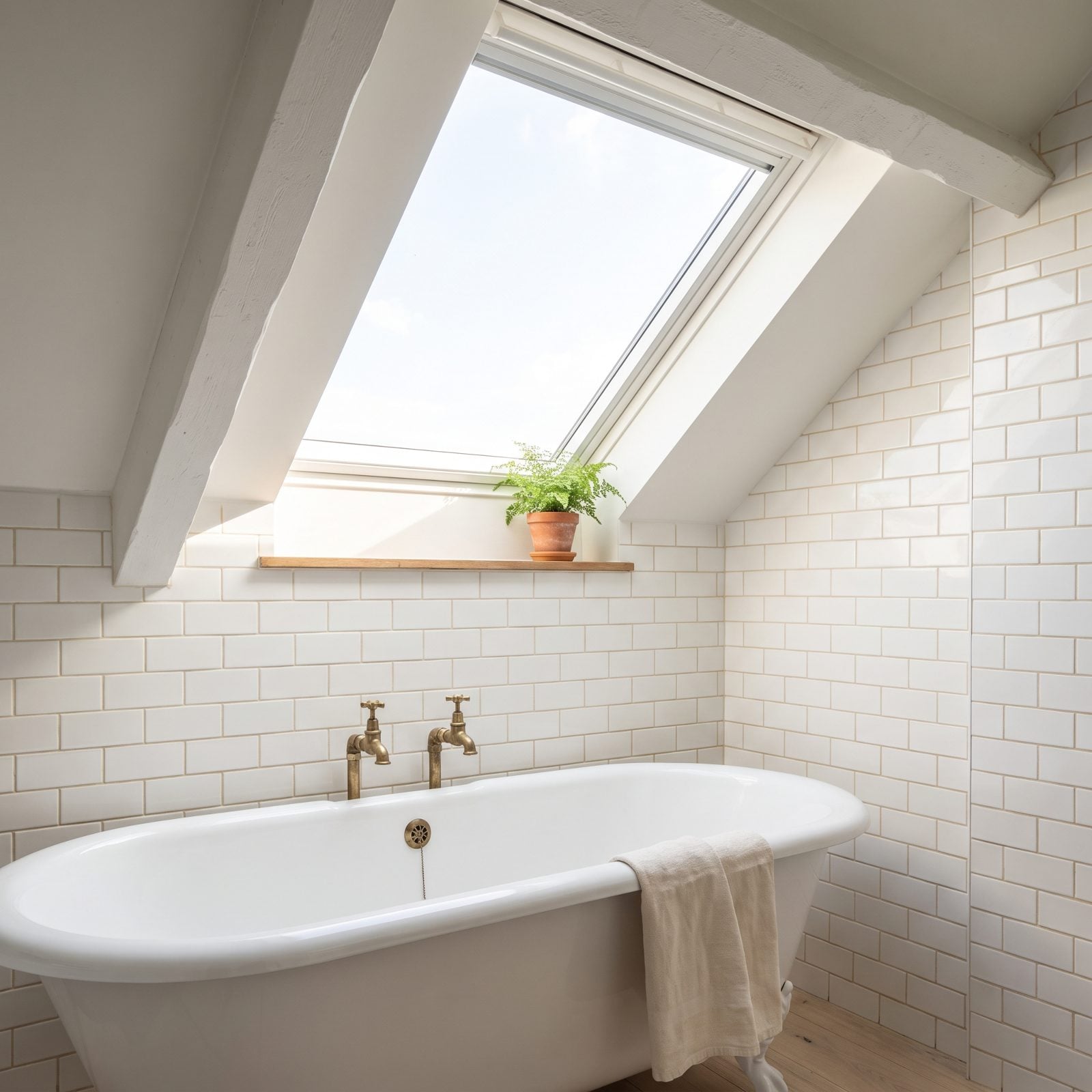 A Skylight Hands the Room an Extra Ceiling