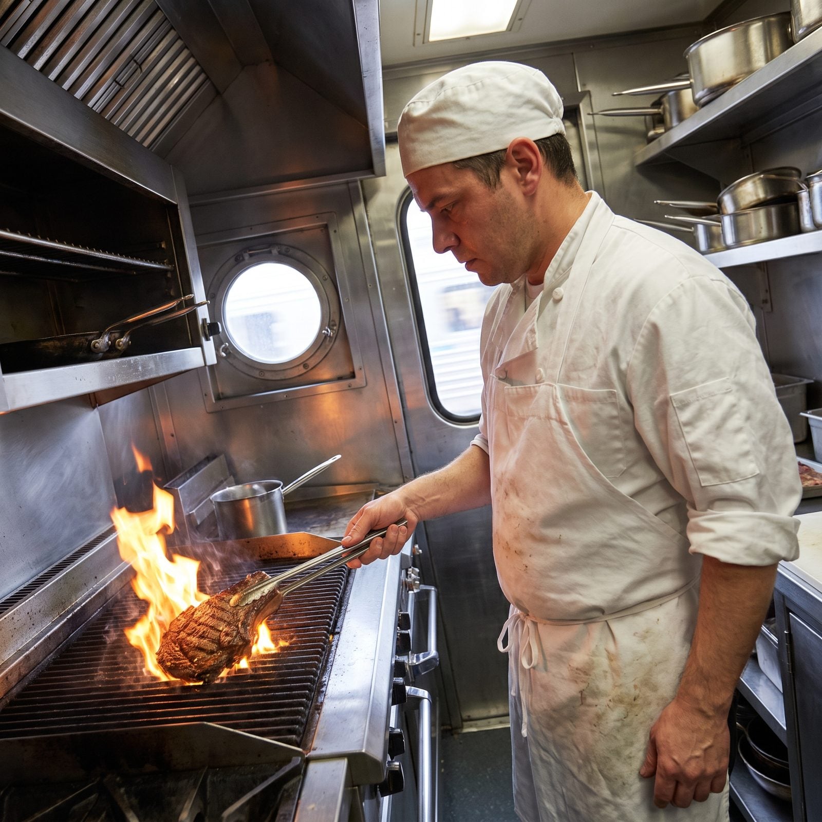 Steaks Broiled in a Tiny Moving Kitchen