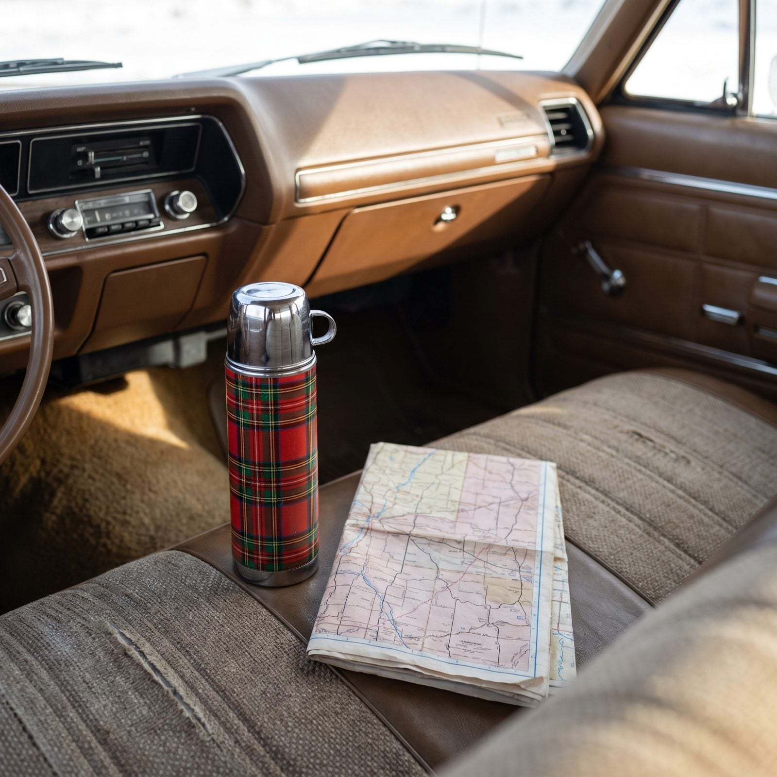 The Thermos of Coffee Beside the Folded Paper Road Map