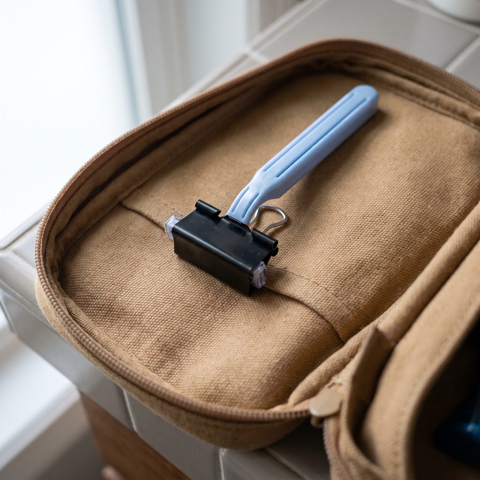 Use a Binder Clip as a Protective Cover for a Disposable Razor